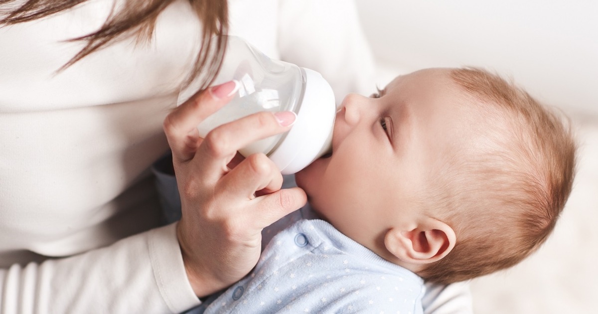 Mother feeding newborn baby
