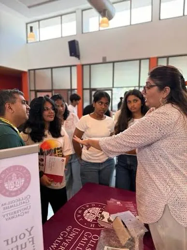 A student and parent speaking with an admissions rep